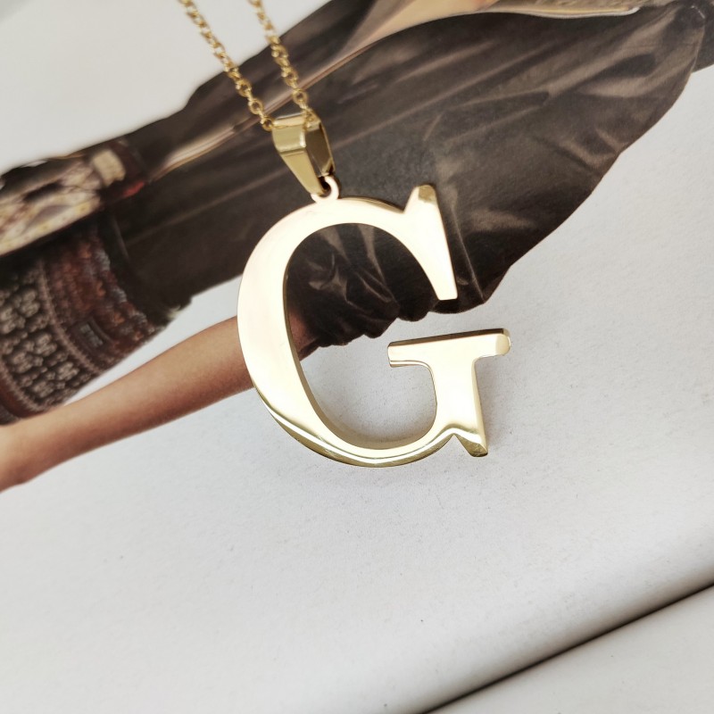 Naszyjnik stal chirurgiczna literka platerowana złotem NST100G